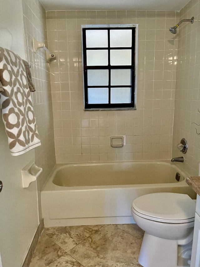 bathroom with toilet and shower / bathtub combination with curtain