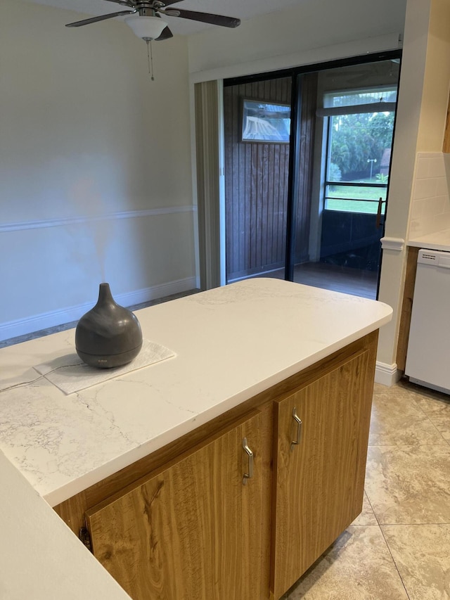 kitchen with light tile patterned floors, dishwasher, and ceiling fan