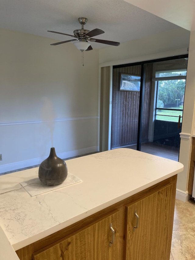 kitchen featuring ceiling fan