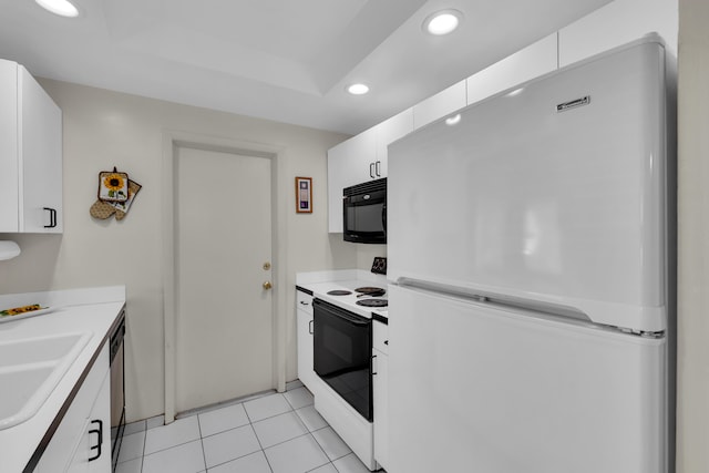 kitchen with white appliances, white cabinetry, light tile patterned flooring, and sink