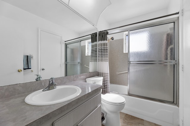 full bathroom featuring shower / bath combination with curtain, tile patterned floors, vanity, and toilet