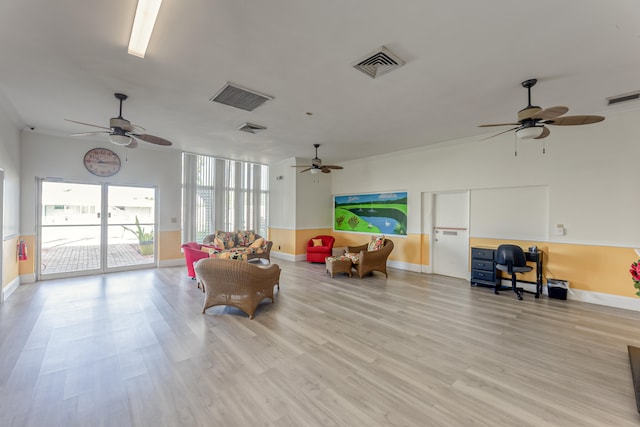 living area featuring ceiling fan and light hardwood / wood-style flooring