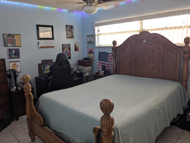 tiled bedroom with ceiling fan