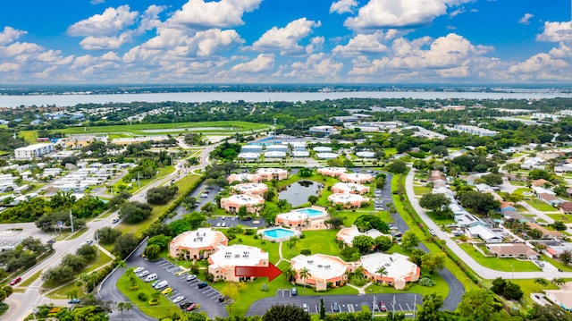 birds eye view of property with a water view