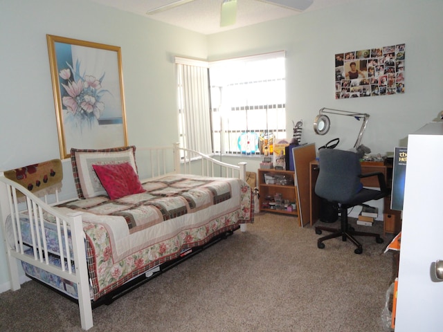 bedroom with ceiling fan and carpet floors