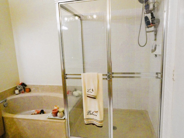 bathroom with separate shower and tub