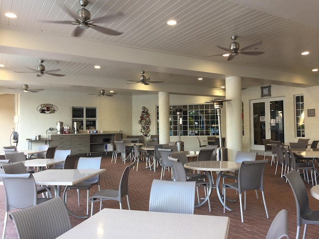 dining area with beam ceiling and ceiling fan