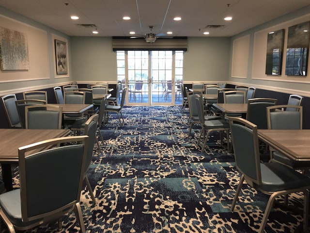 game room featuring dark colored carpet