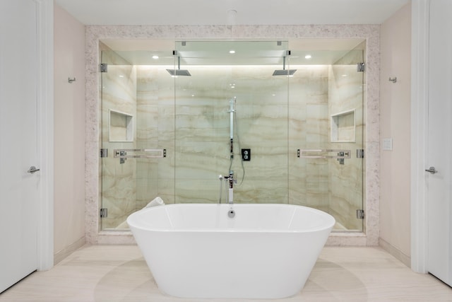 bathroom featuring independent shower and bath and tile patterned floors