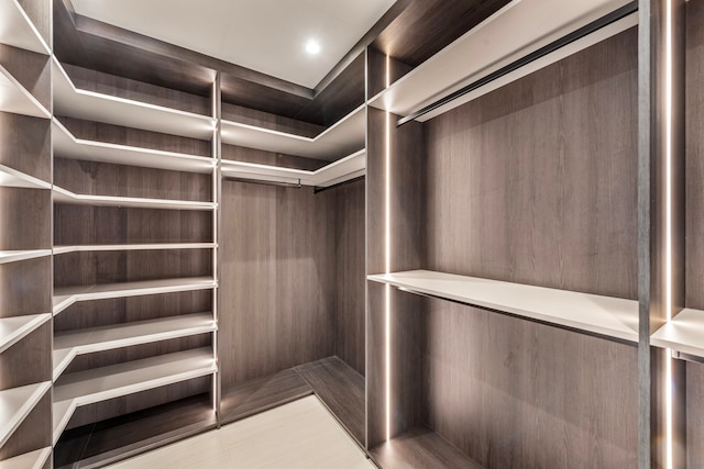 walk in closet featuring elevator