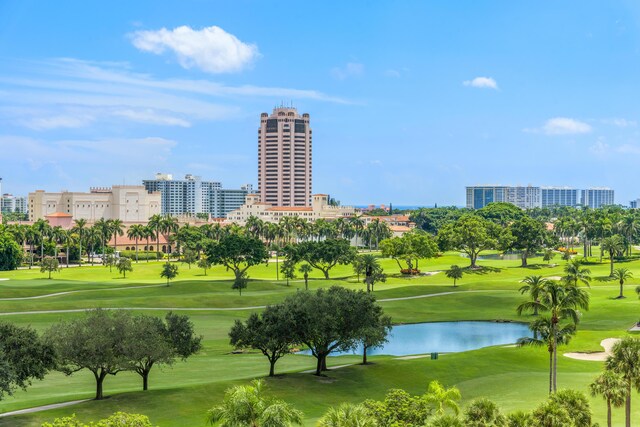 view of community with a yard and a water view