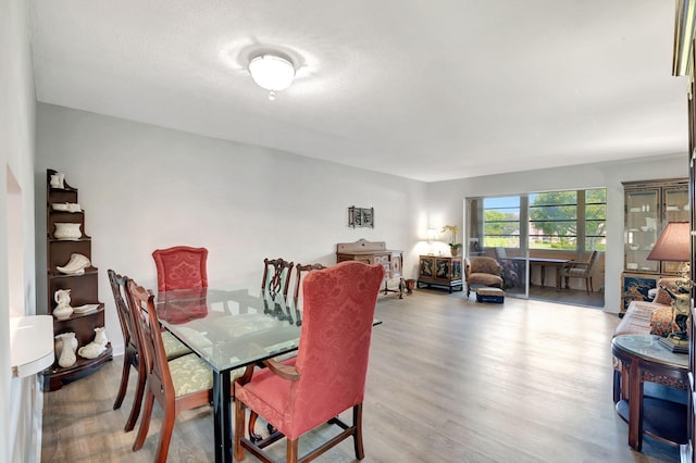 dining space with light wood-type flooring