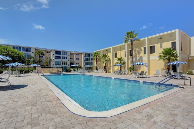 view of swimming pool featuring a patio area