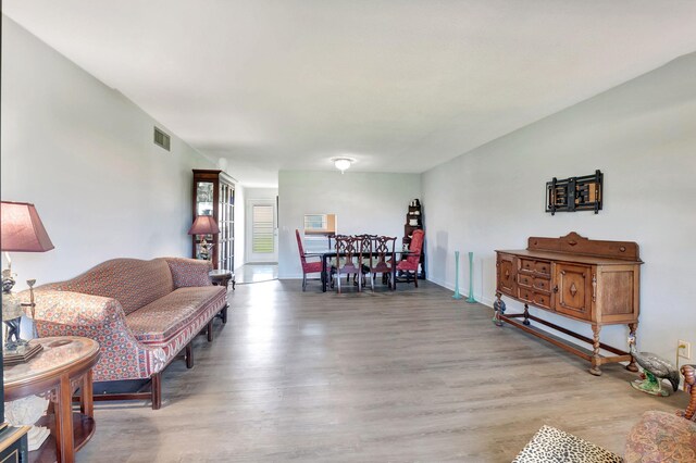 kitchen featuring decorative light fixtures, appliances with stainless steel finishes, cream cabinetry, and sink