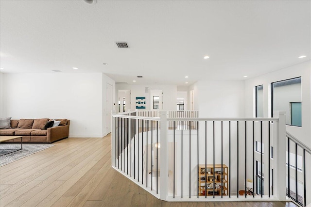 corridor featuring light hardwood / wood-style floors