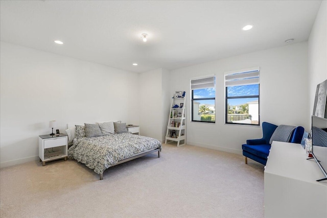 bedroom featuring light colored carpet