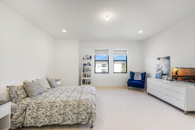 bedroom featuring light carpet