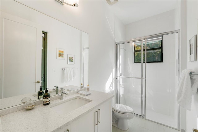 bathroom with vanity, toilet, and an enclosed shower