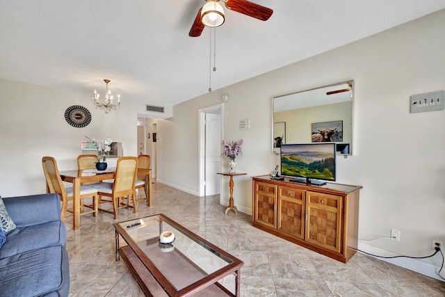 living room with ceiling fan with notable chandelier