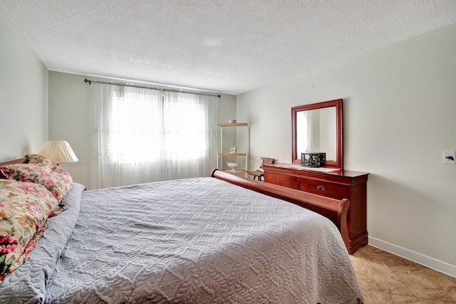 bedroom featuring a textured ceiling