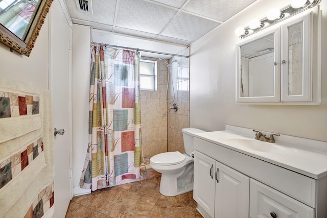 bathroom featuring curtained shower, vanity, toilet, and tile patterned floors