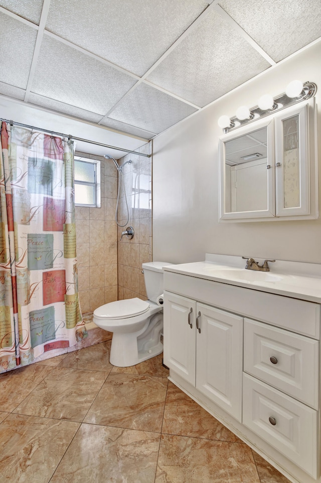 bathroom featuring tile patterned floors, walk in shower, vanity, and toilet