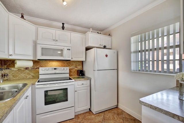 kitchen with light tile patterned floors, white appliances, white cabinetry, crown molding, and decorative backsplash