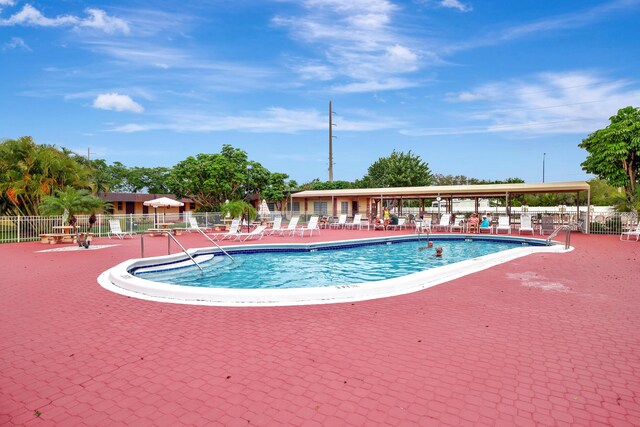 view of swimming pool with a patio