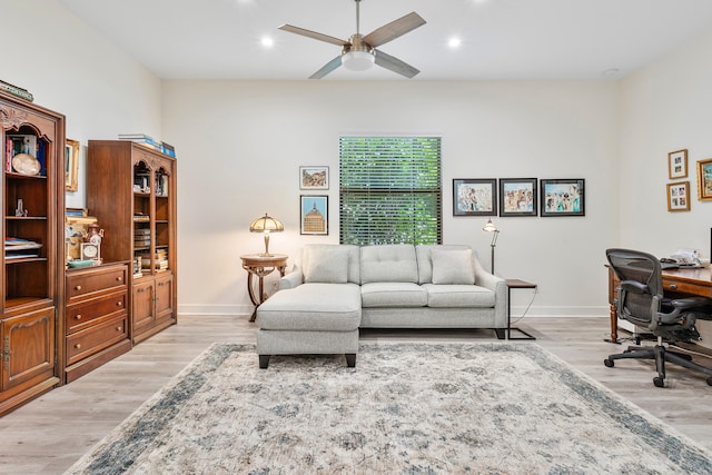 home office featuring ceiling fan and light hardwood / wood-style floors