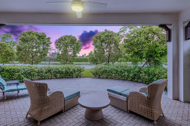 view of patio terrace at dusk