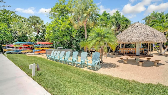 view of community with a gazebo, a yard, and an outdoor bar