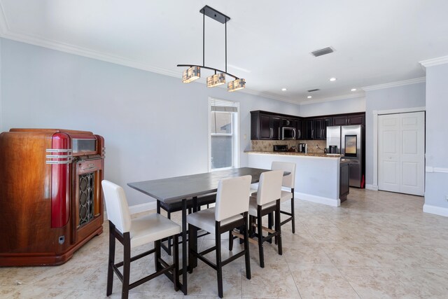 tiled dining area with ornamental molding