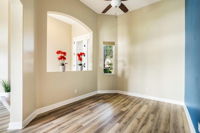 unfurnished room featuring ceiling fan and wood-type flooring