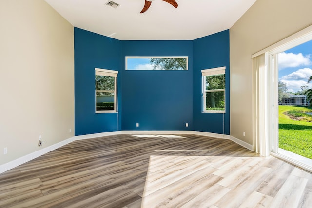 spare room featuring ceiling fan and light hardwood / wood-style floors