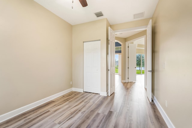 interior space with ceiling fan and light wood-type flooring