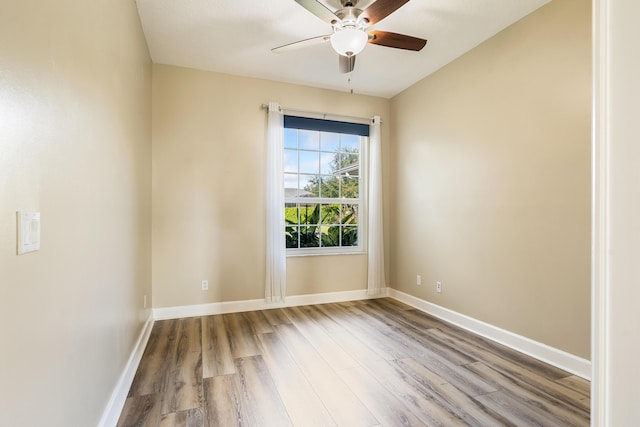 empty room with light hardwood / wood-style flooring and ceiling fan