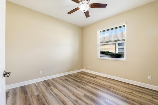 empty room featuring ceiling fan and wood-type flooring