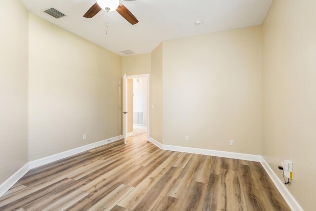 unfurnished room featuring ceiling fan and light hardwood / wood-style flooring