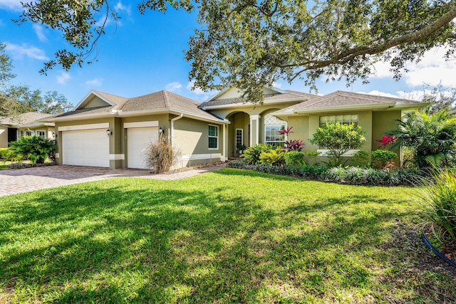 ranch-style house with a front yard and a garage