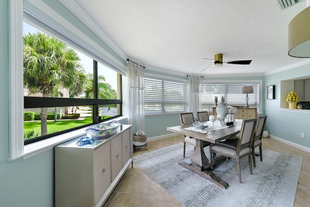 sunroom with ceiling fan and plenty of natural light