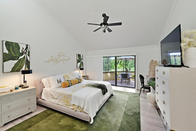 bedroom featuring light wood-type flooring, ceiling fan, lofted ceiling, access to outside, and ornamental molding