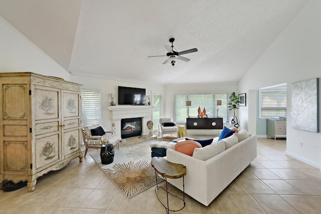 tiled living room featuring ornamental molding, high vaulted ceiling, and ceiling fan