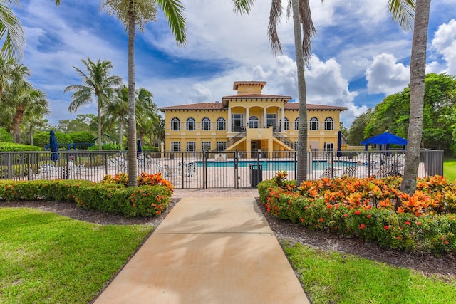 view of building exterior with a community pool