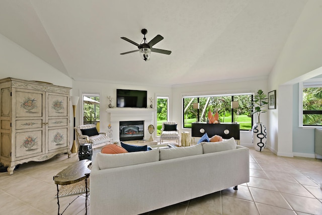 tiled living room with ceiling fan, high vaulted ceiling, and plenty of natural light