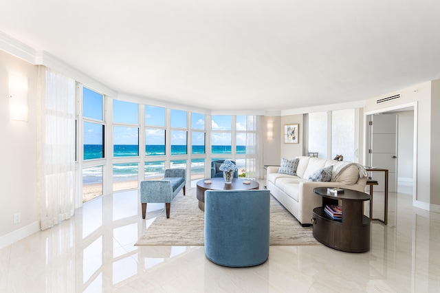 living room with floor to ceiling windows, light tile patterned flooring, plenty of natural light, and a water view