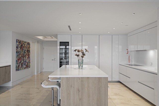 kitchen featuring white cabinetry and a kitchen island