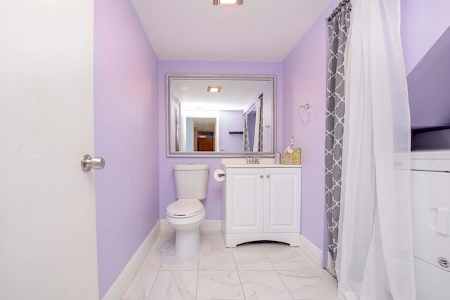 bathroom featuring vanity, toilet, and curtained shower