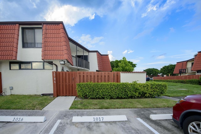 view of property exterior featuring a lawn