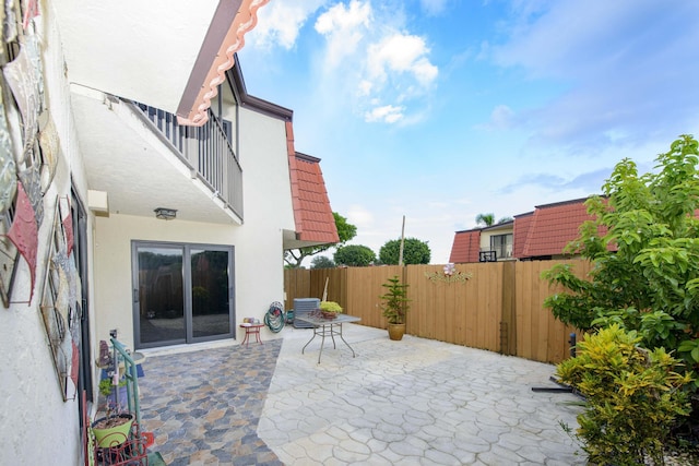 view of patio / terrace with a balcony