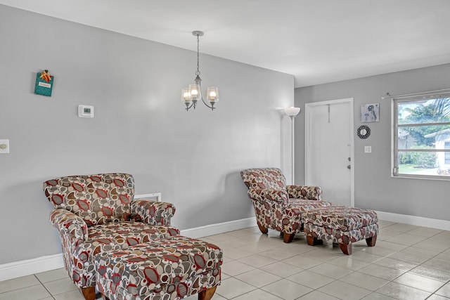 living area featuring an inviting chandelier and light tile patterned flooring